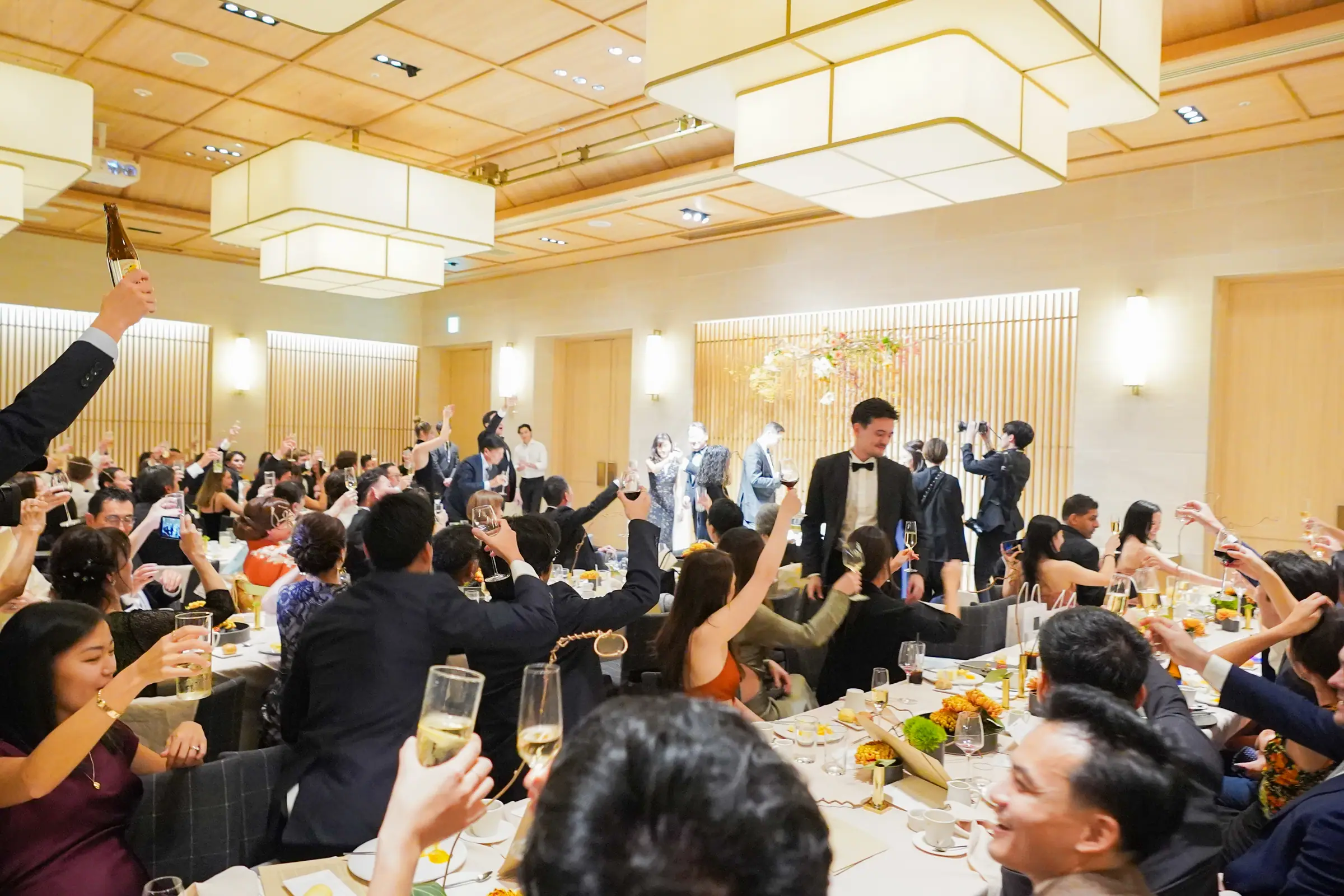 Guests raising their glasses for a toast