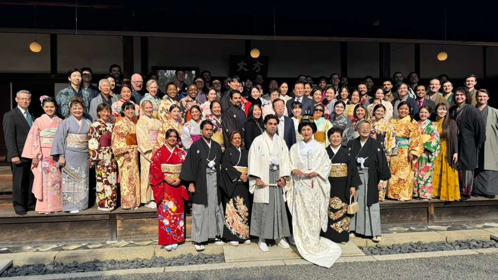 Wedding party celebrating together outdoors in Japan